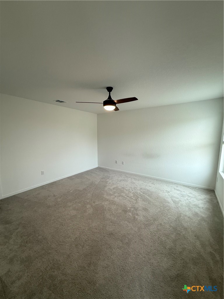 3230 Mound Ridge New Braunfels, TX 78130 - Photo 10 of 15 an empty room with a ceiling fan and window