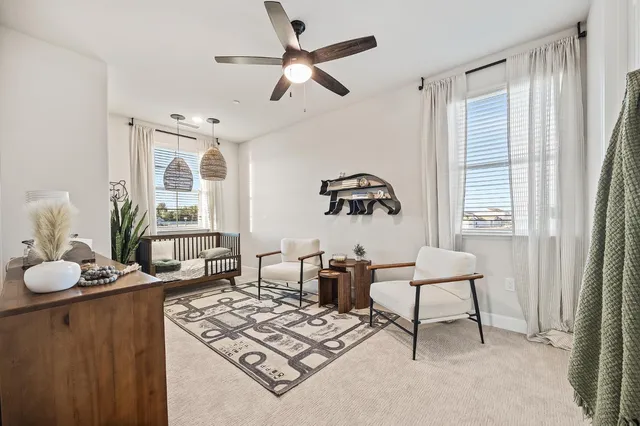 a living room with furniture and a window