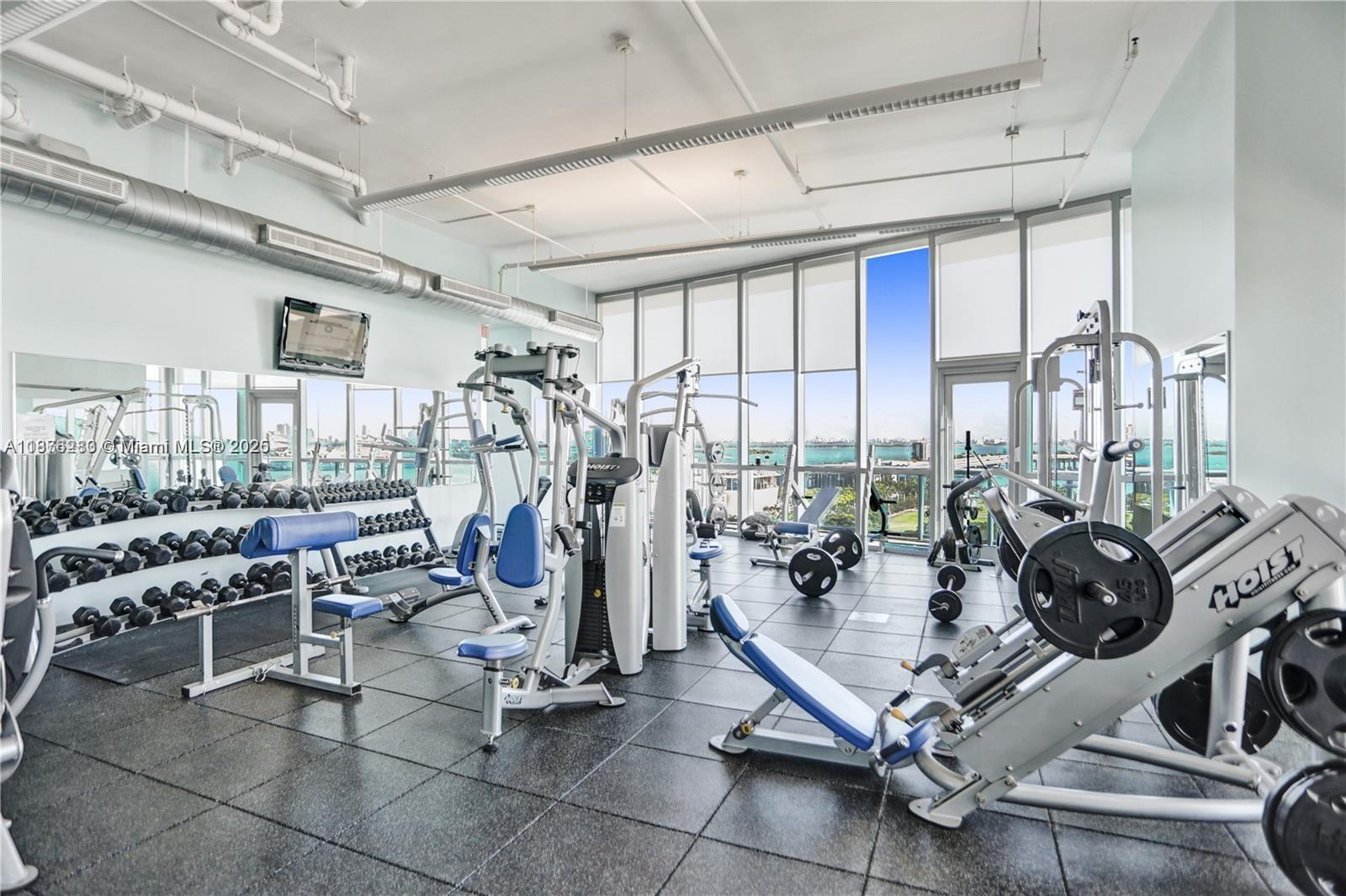 888 Biscayne Boulevard, Unit 5102 Miami, FL 33132 - Photo 27 of 34 a view of a room with gym equipment
