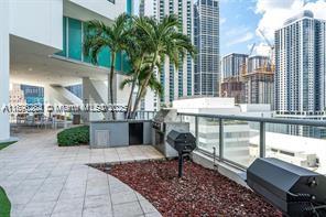 888 Biscayne Boulevard, Unit 5102 Miami, FL 33132 - Photo 30 of 34 a front view of a building with outdoor seating