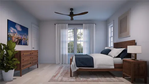 a bedroom with a large bed and a window