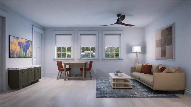 a living room with furniture and a wooden floor