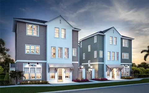 a front view of a residential apartment building with a yard