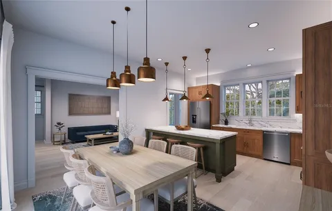 a kitchen island with a table chairs stove and wooden floor