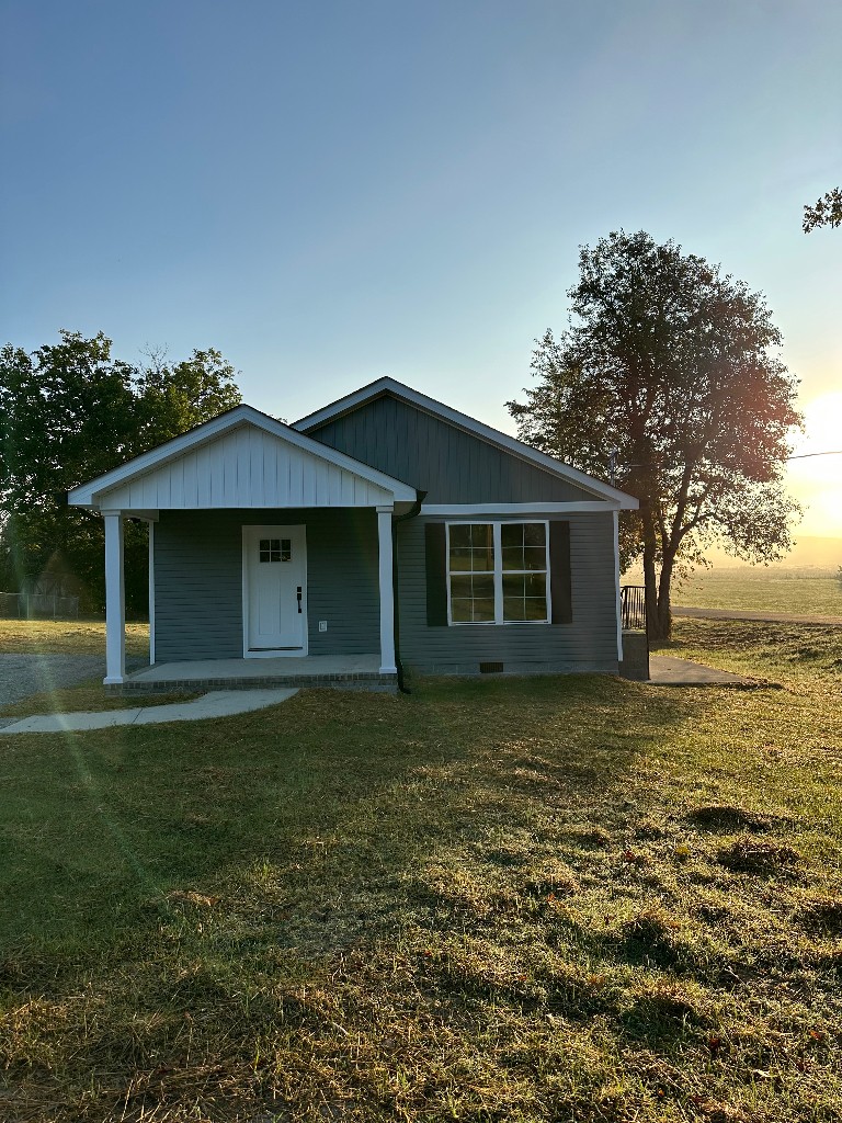1295 Bethel Road Pulaski, TN 38478 - Photo 1 of 17 a front view of a house with garden