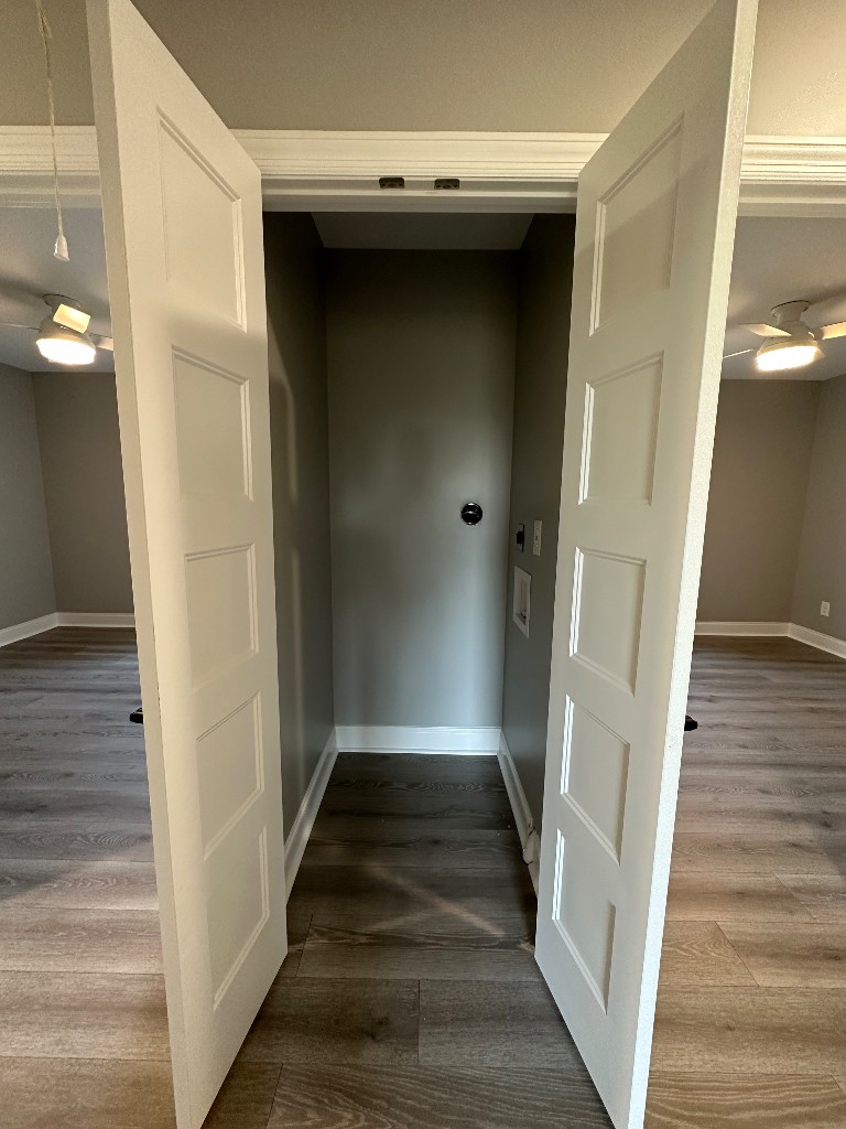 1295 Bethel Road Pulaski, TN 38478 - Photo 6 of 17 a view of a hallway with wooden floor and staircase