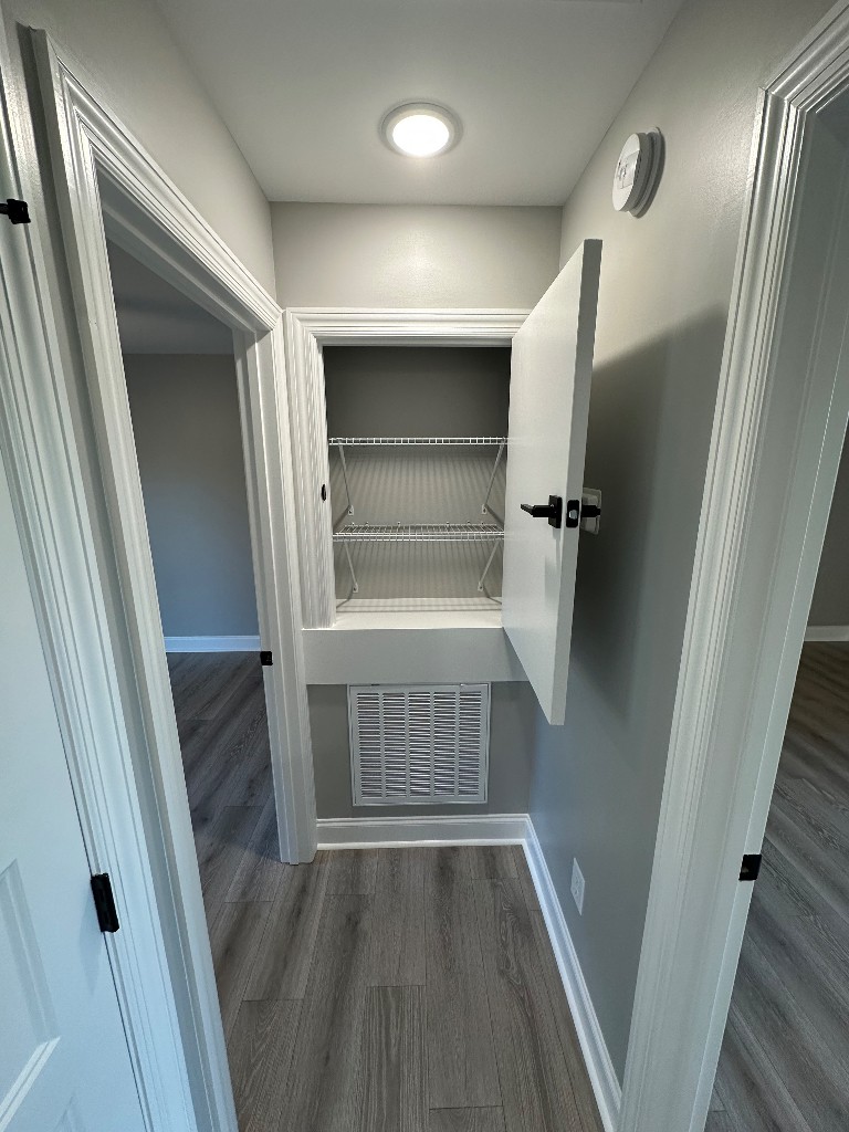 1295 Bethel Road Pulaski, TN 38478 - Photo 8 of 17 a view of walk in closet with wooden floor and cabinet