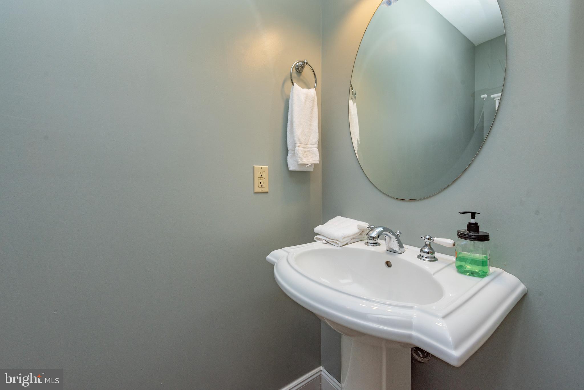 2828 Glendale Road Swanton, MD 21561 - Photo 18 of 78 a bathroom with a sink and a mirror