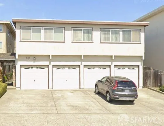 a car parked in front of a house