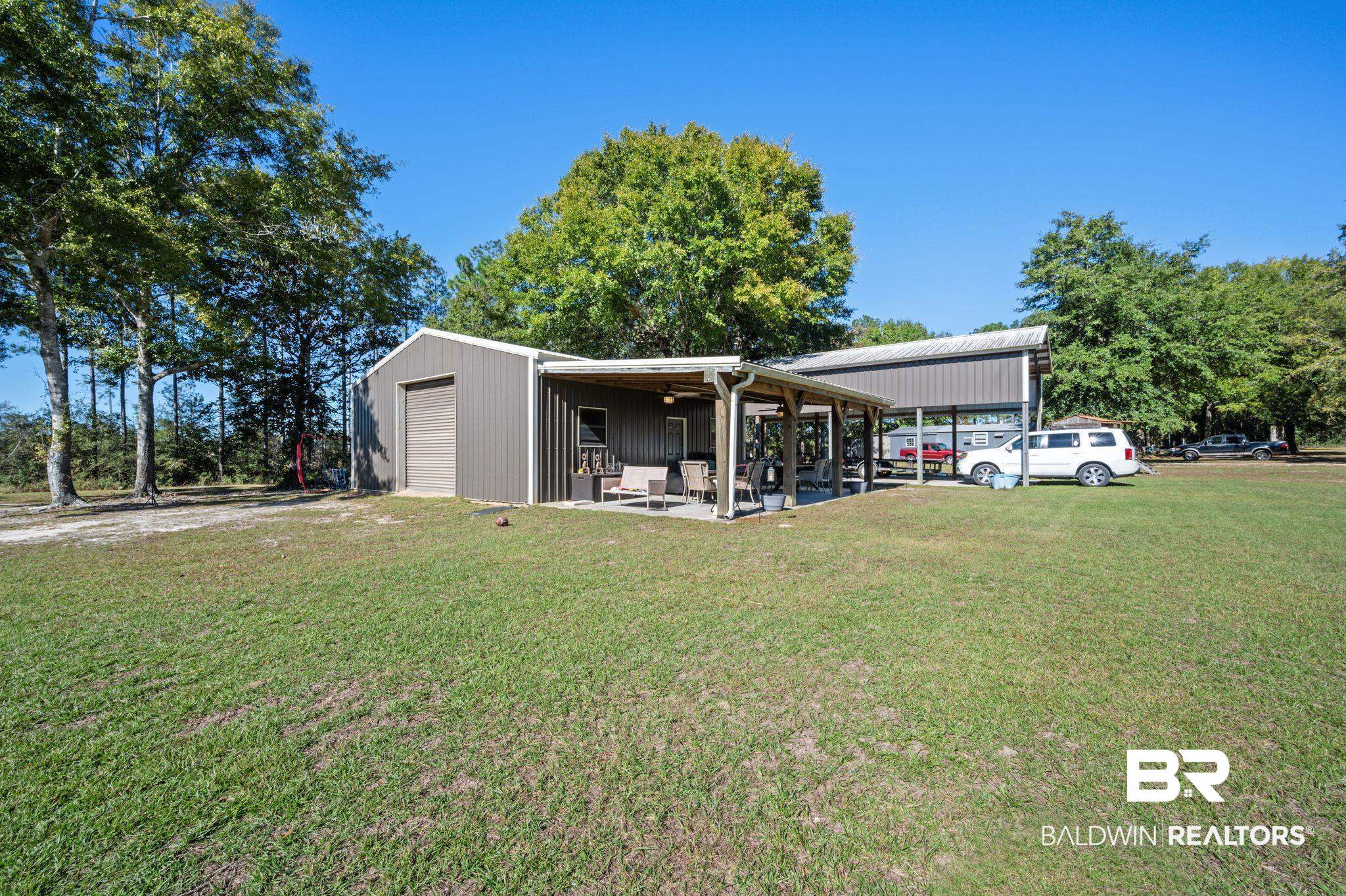 38211-d) V R Byrd Road Bay Minette, AL 36507 - Photo 37 of 58 Exterior space with a front yard, an outbuilding, a garage, and a carport