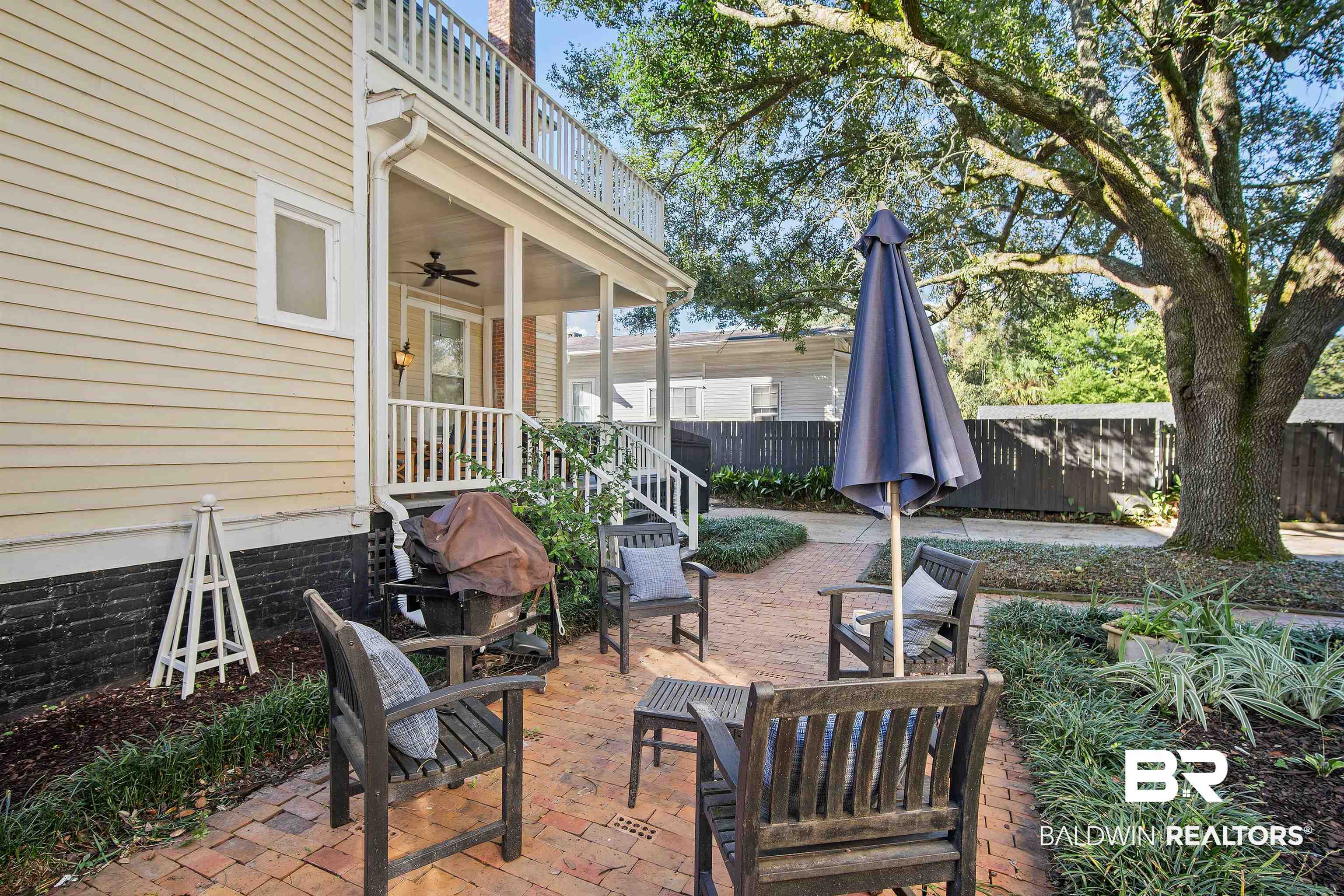 1314 Dauphin Street Mobile, AL 36604 - Photo 49 of 61 View of patio with ceiling fan and a balcony