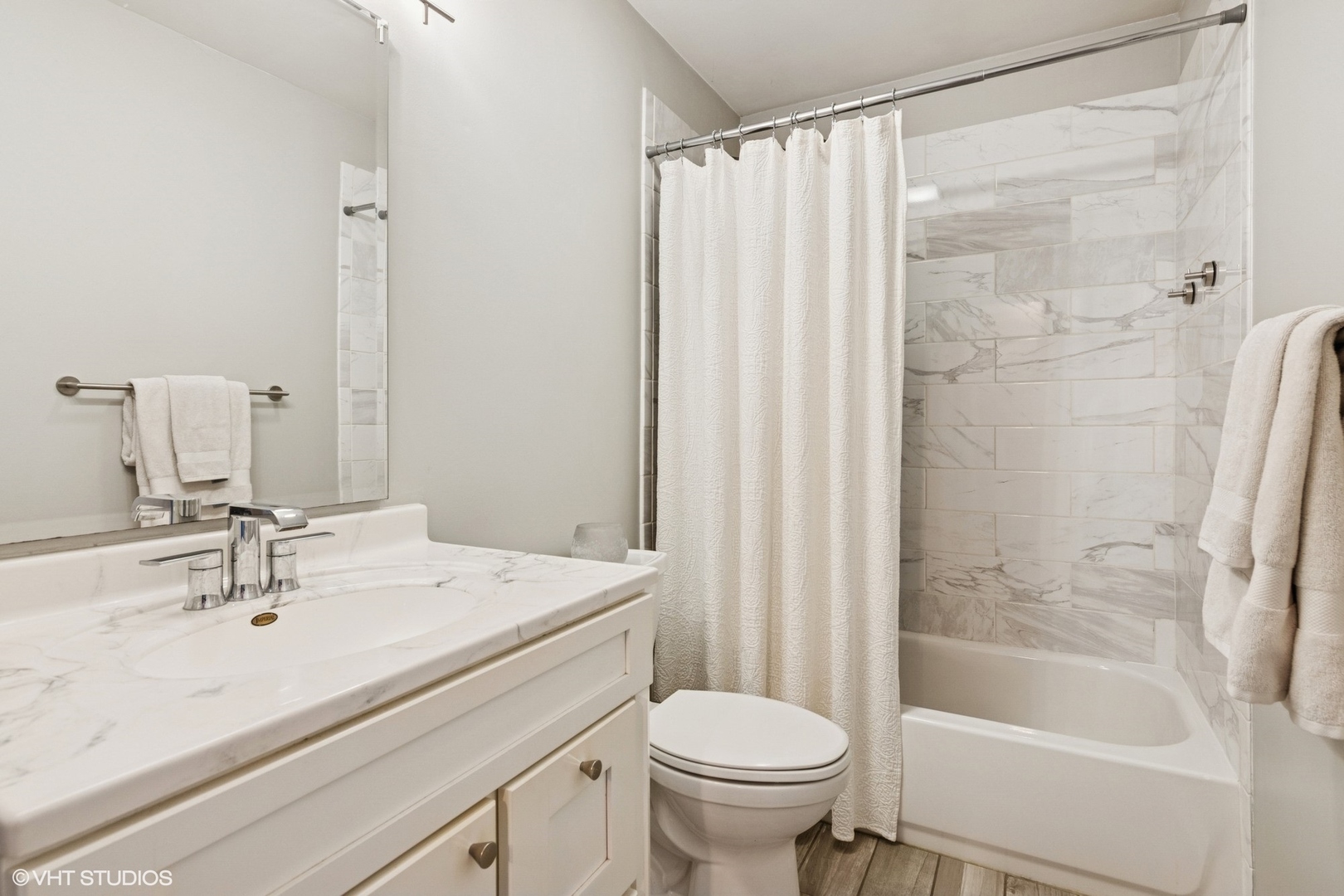 N101 Pleasant Hill Road Wheaton, IL 60187 - Photo 12 of 29 a bathroom with a sink toilet and shower
