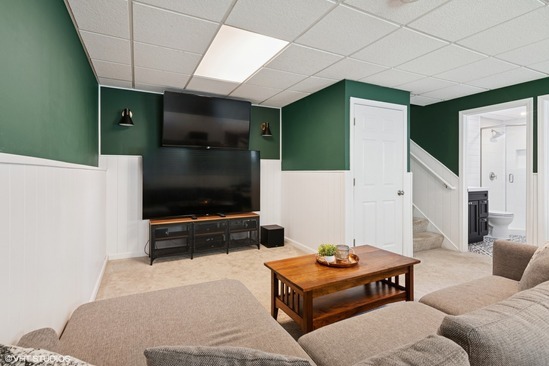 N101 Pleasant Hill Road Wheaton, IL 60187 - Photo 14 of 29 a living room with furniture and a flat screen tv