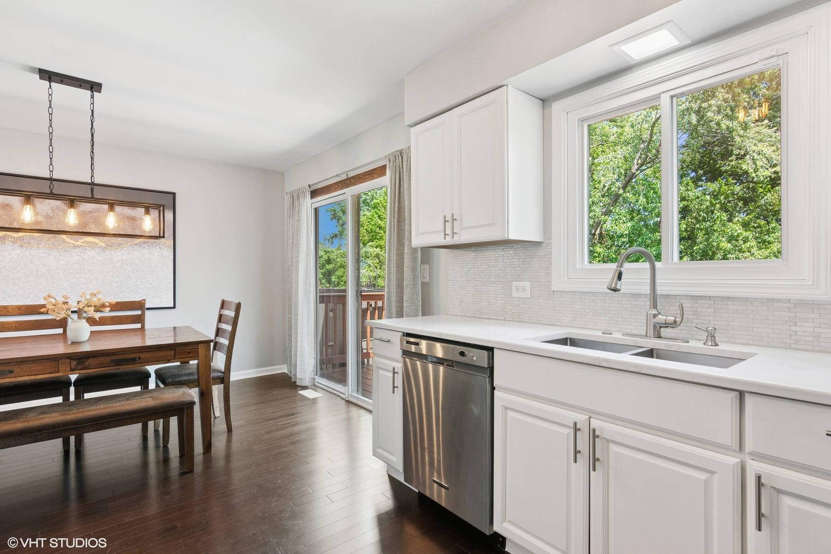 N101 Pleasant Hill Road Wheaton, IL 60187 - Photo 8 of 29 a kitchen with a table chairs sink and cabinets