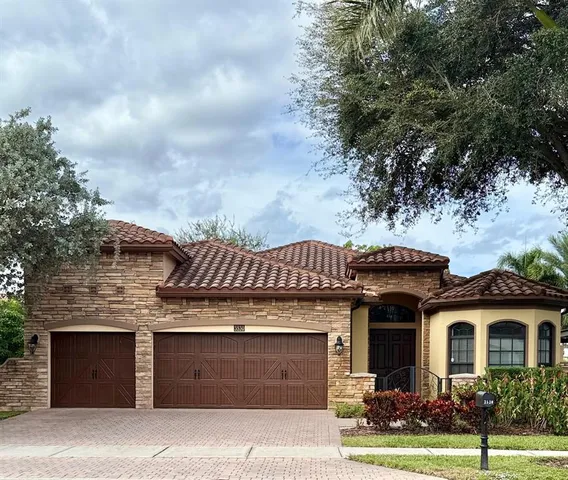a front view of a house with yard