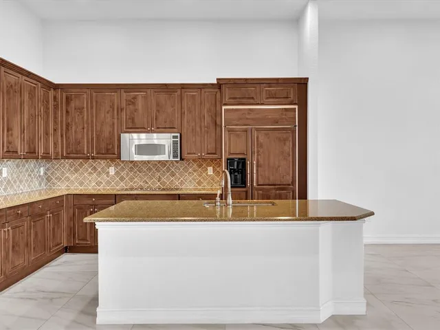 a view of an empty room with a tv