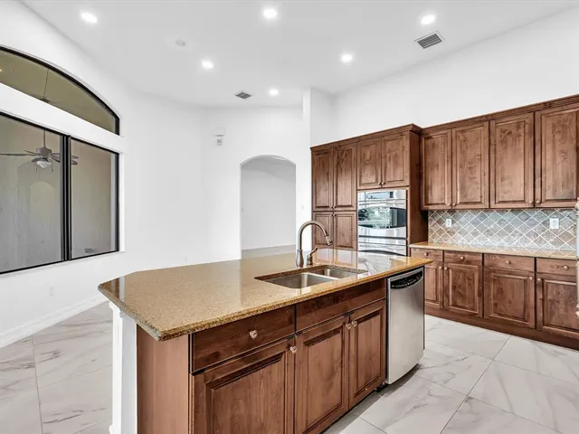 a view of a room with wooden floor and door