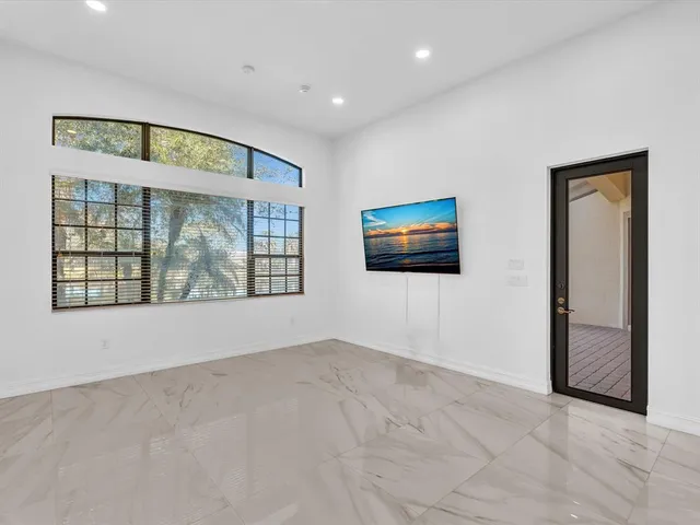 a view of a room with a large window