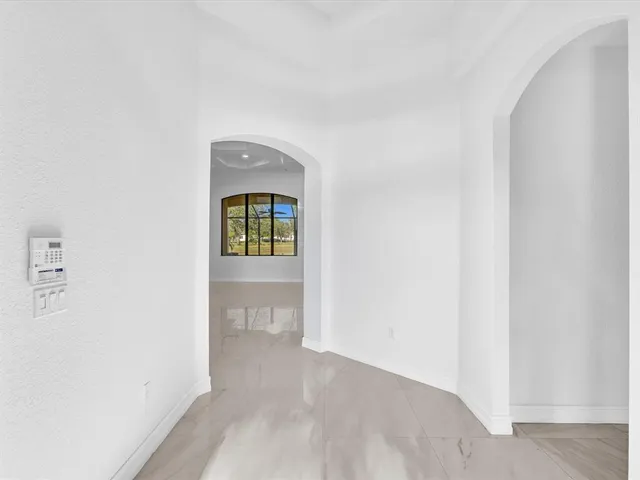 a kitchen with stainless steel appliances granite countertop a sink and a refrigerator