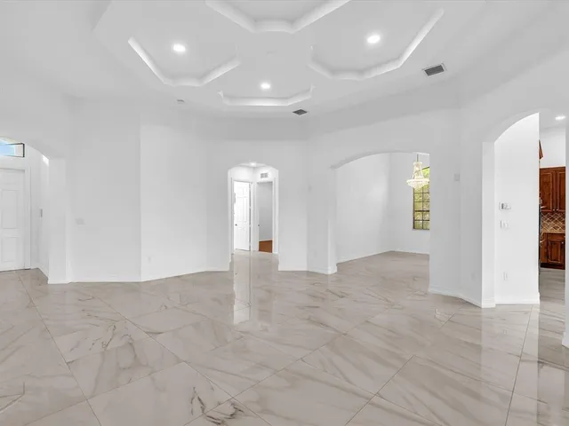 a kitchen that has a sink and a stove top oven