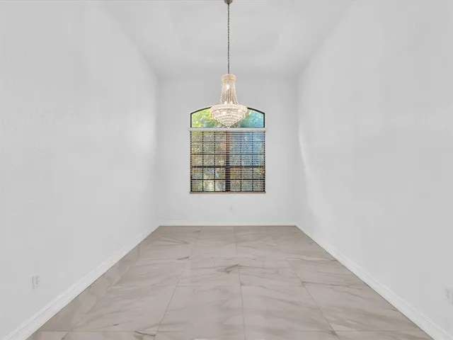 a kitchen with a sink a refrigerator and window