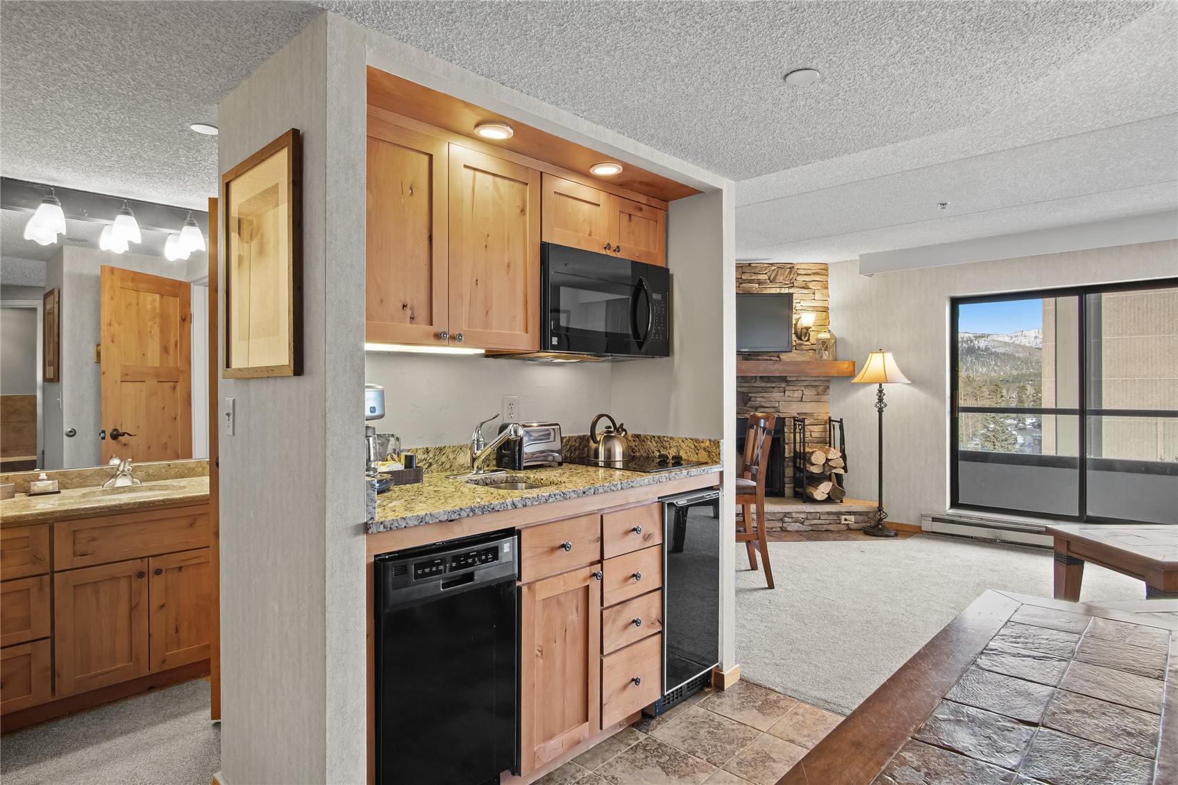 640 Village Road, Unit 4501 Breckenridge, CO 80424 - Photo 11 of 42 a kitchen with a sink stove and cabinets