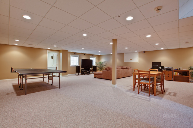 1390 Gettysburg Road Long Grove, IL 60047 - Photo 18 of 25 a big room with furniture and a table with wooden floor