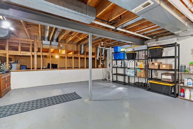 a view of an empty room with furniture