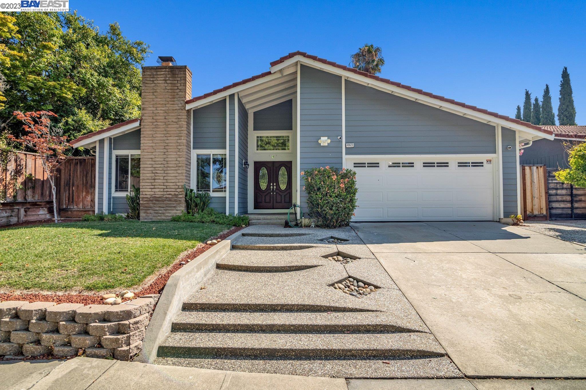 48620 Taos Road Fremont, CA 94539 - Photo 1 of 1 a front view of a house with a yard