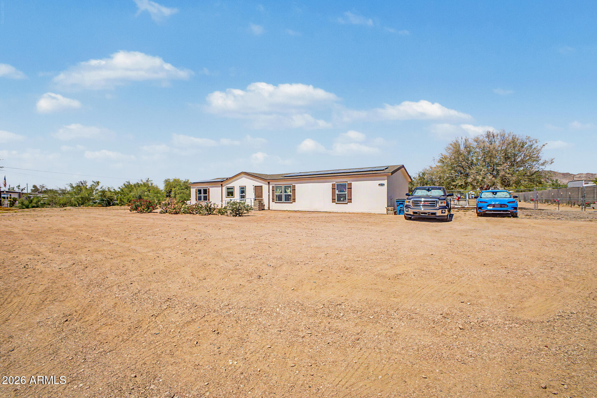 2576 West Tepee Street Apache Junction, AZ 85120 - Photo 3 of 29 a view of house with outdoor space and lakeside