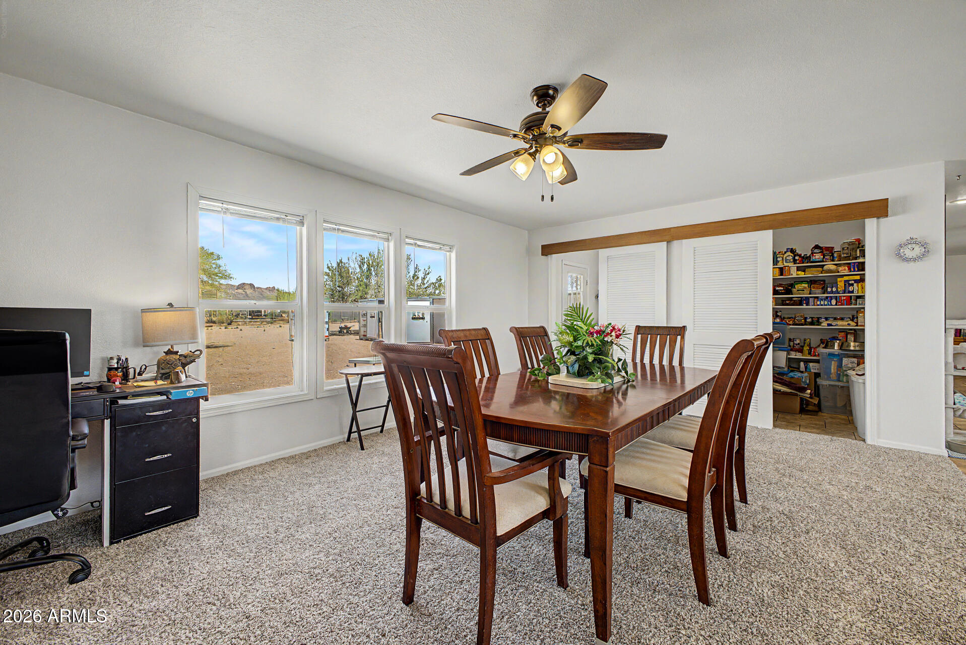 2576 West Tepee Street Apache Junction, AZ 85120 - Photo 7 of 29 a view of a dining room with furniture window and outside view