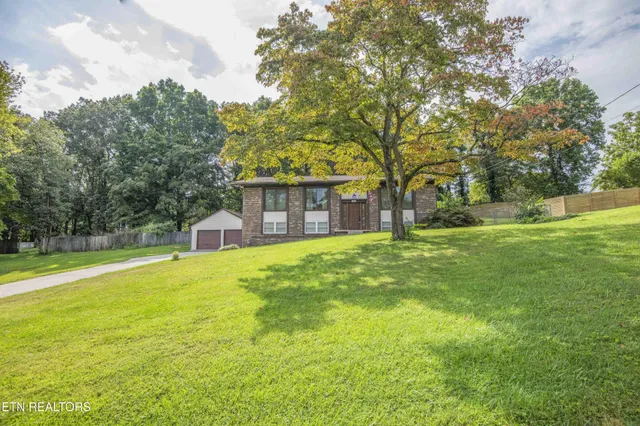 a house view with swimming pool in front of it