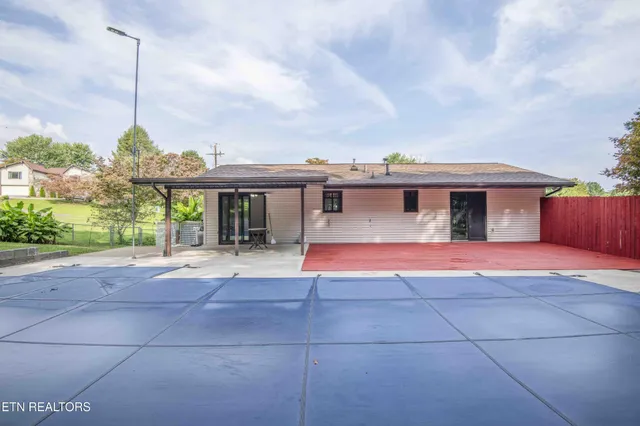a view of a backyard with large trees