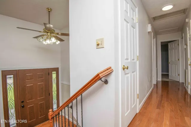 a view of a hallway with a chandelier