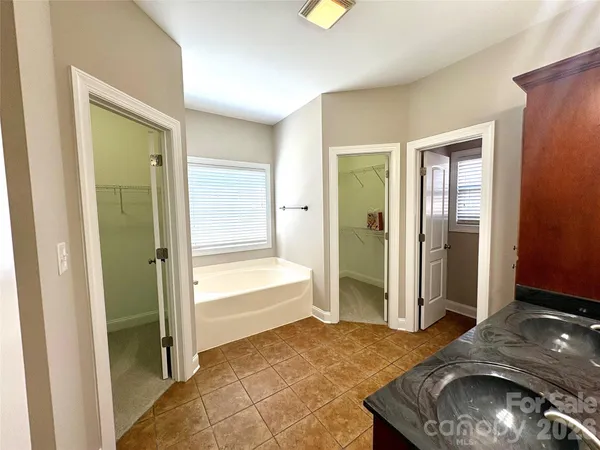 a living room with a sink and a bath tub