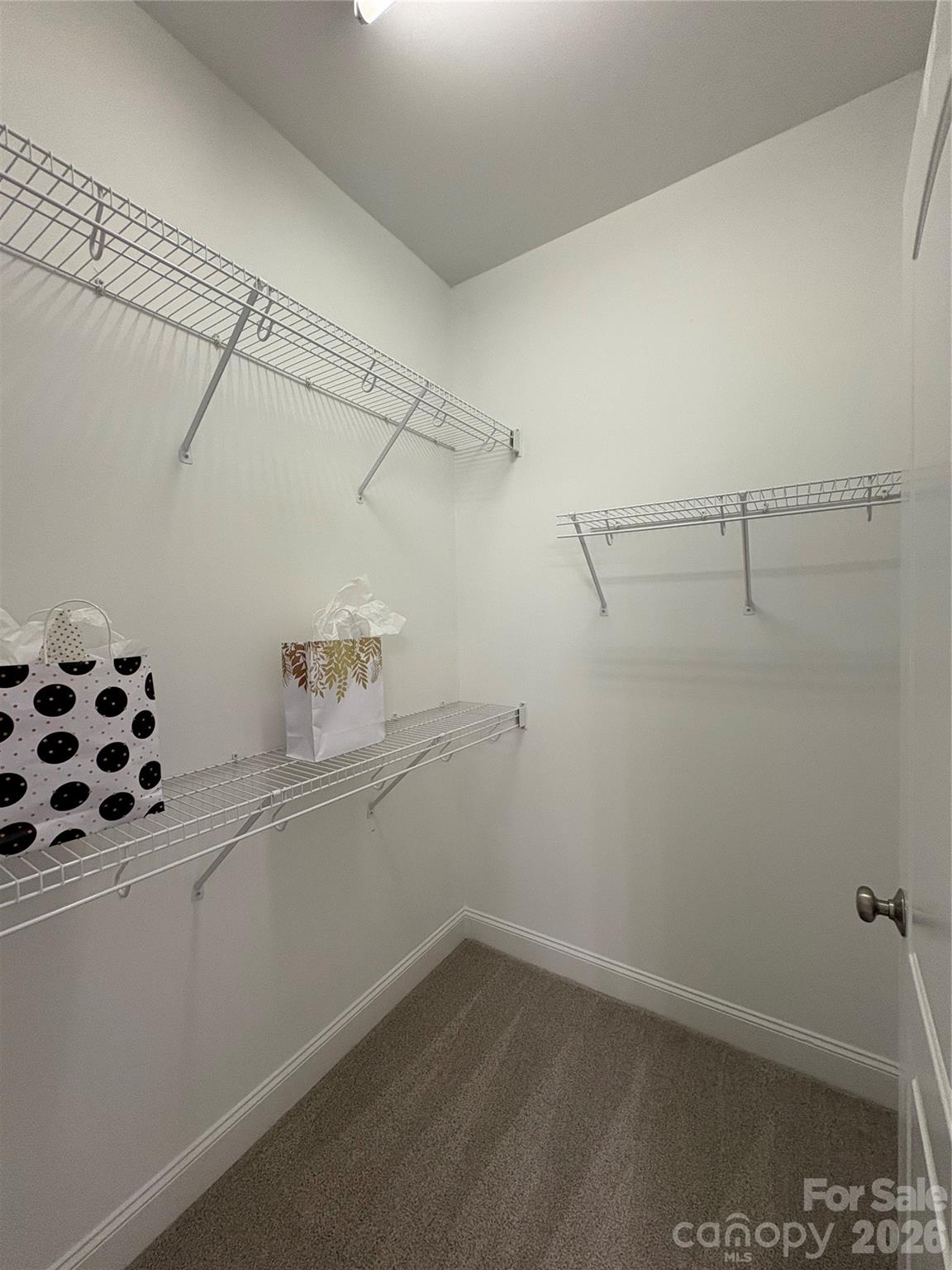 402 Church Street Locust, NC 28097 - Photo 20 of 39 a view of a room with racks on the wall