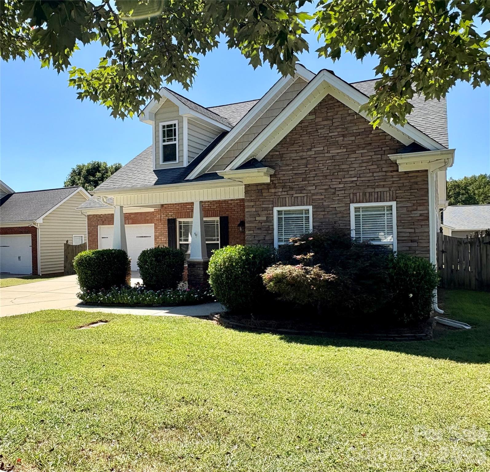 402 Church Street Locust, NC 28097 - Photo 2 of 39 a view of a house with backyard and garden