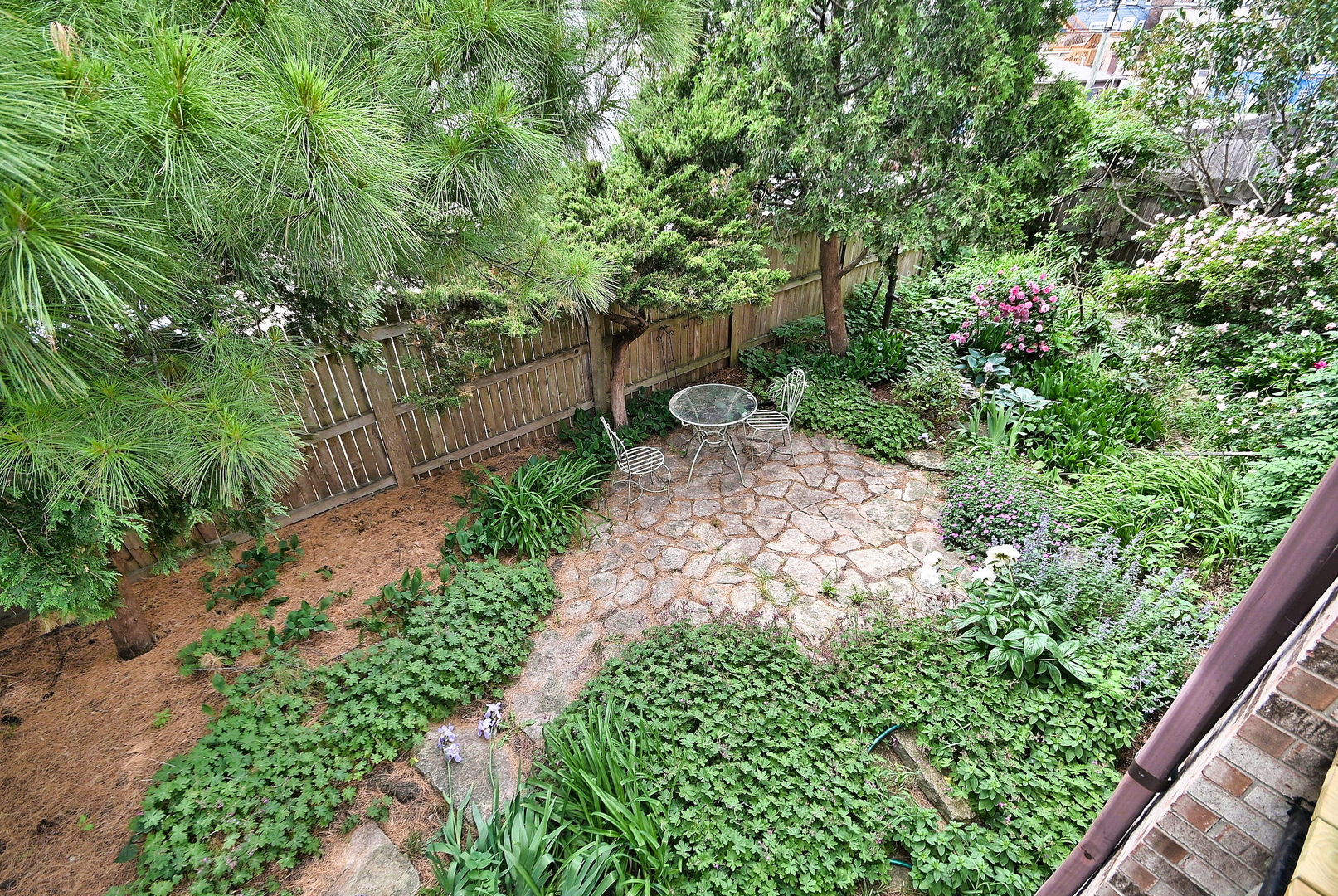2350 North Sayre Avenue, Unit G Chicago, IL 60707 - Photo 25 of 30 a view of a garden with plants and large trees