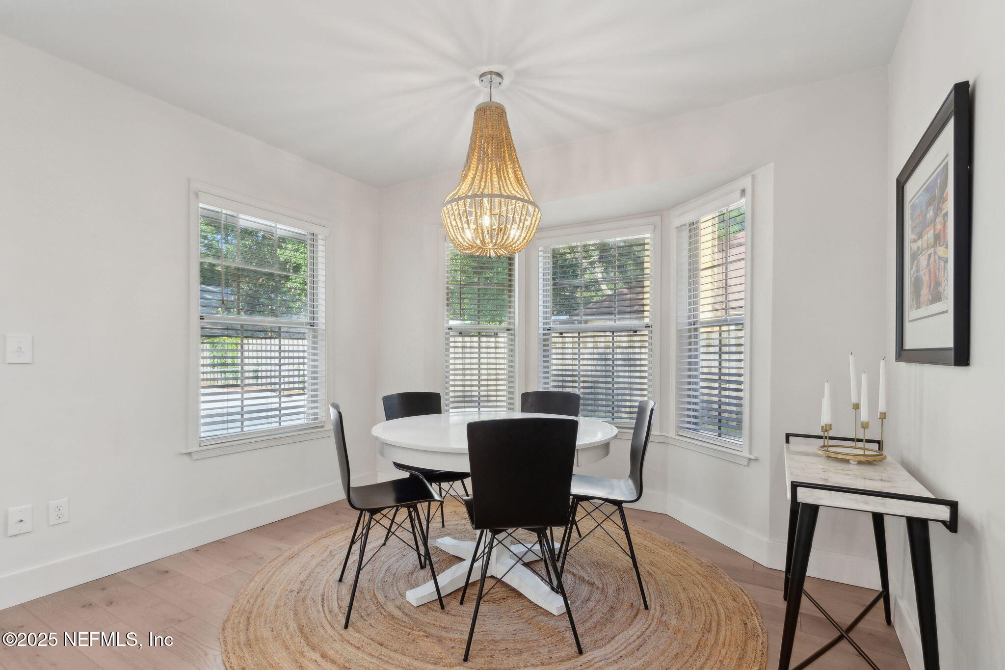1908 Springbrook Road Fernandina Beach, FL 32034 - Photo 17 of 48 a view of a dining room with furniture window and wooden floor