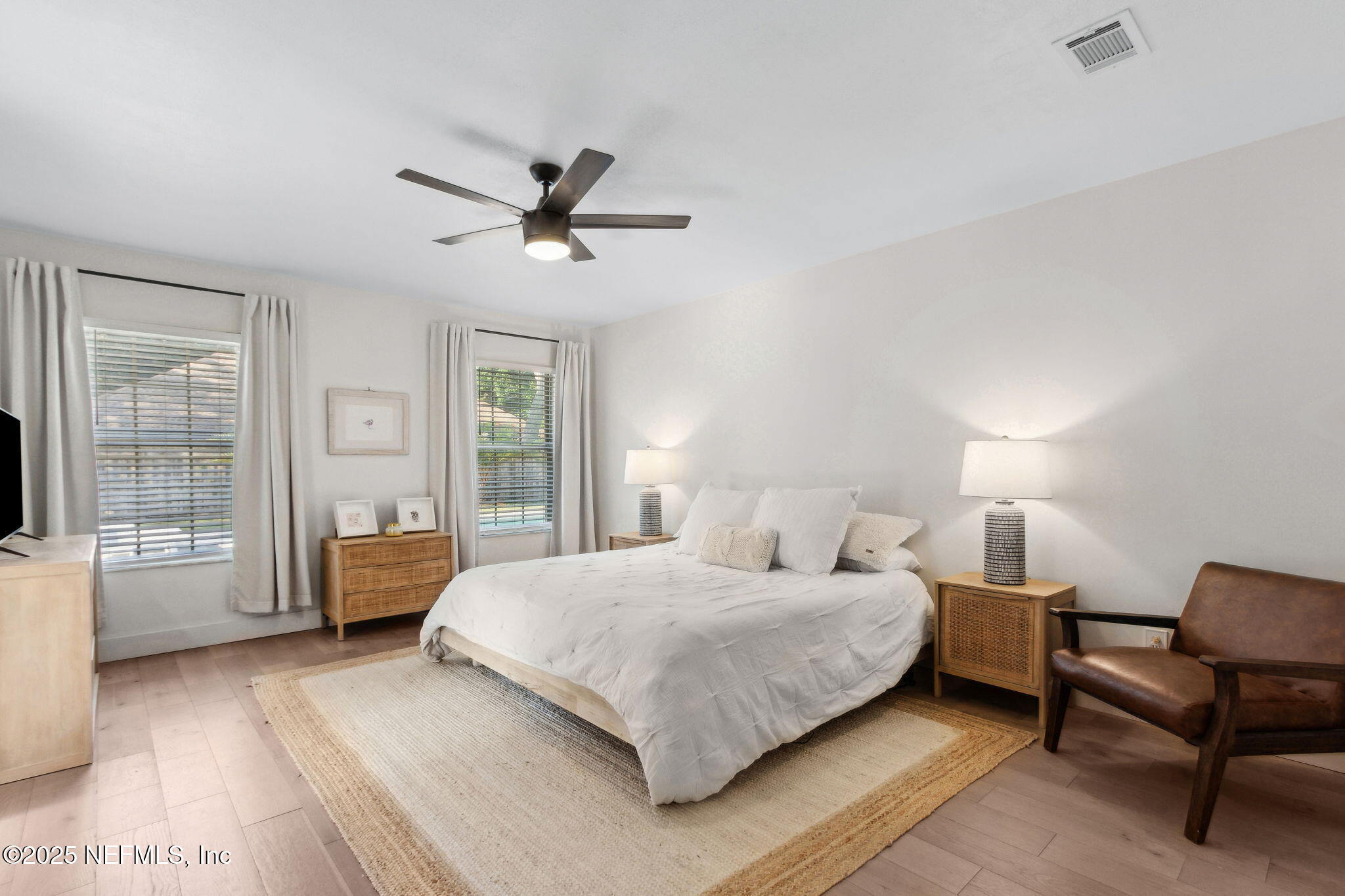 1908 Springbrook Road Fernandina Beach, FL 32034 - Photo 23 of 48 a bedroom with a large bed and a window