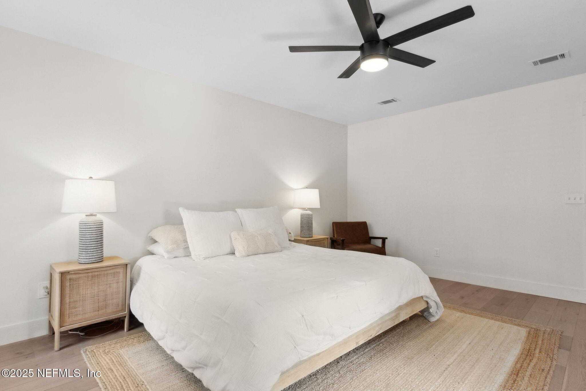 1908 Springbrook Road Fernandina Beach, FL 32034 - Photo 24 of 48 a bedroom with a bed and a lamp