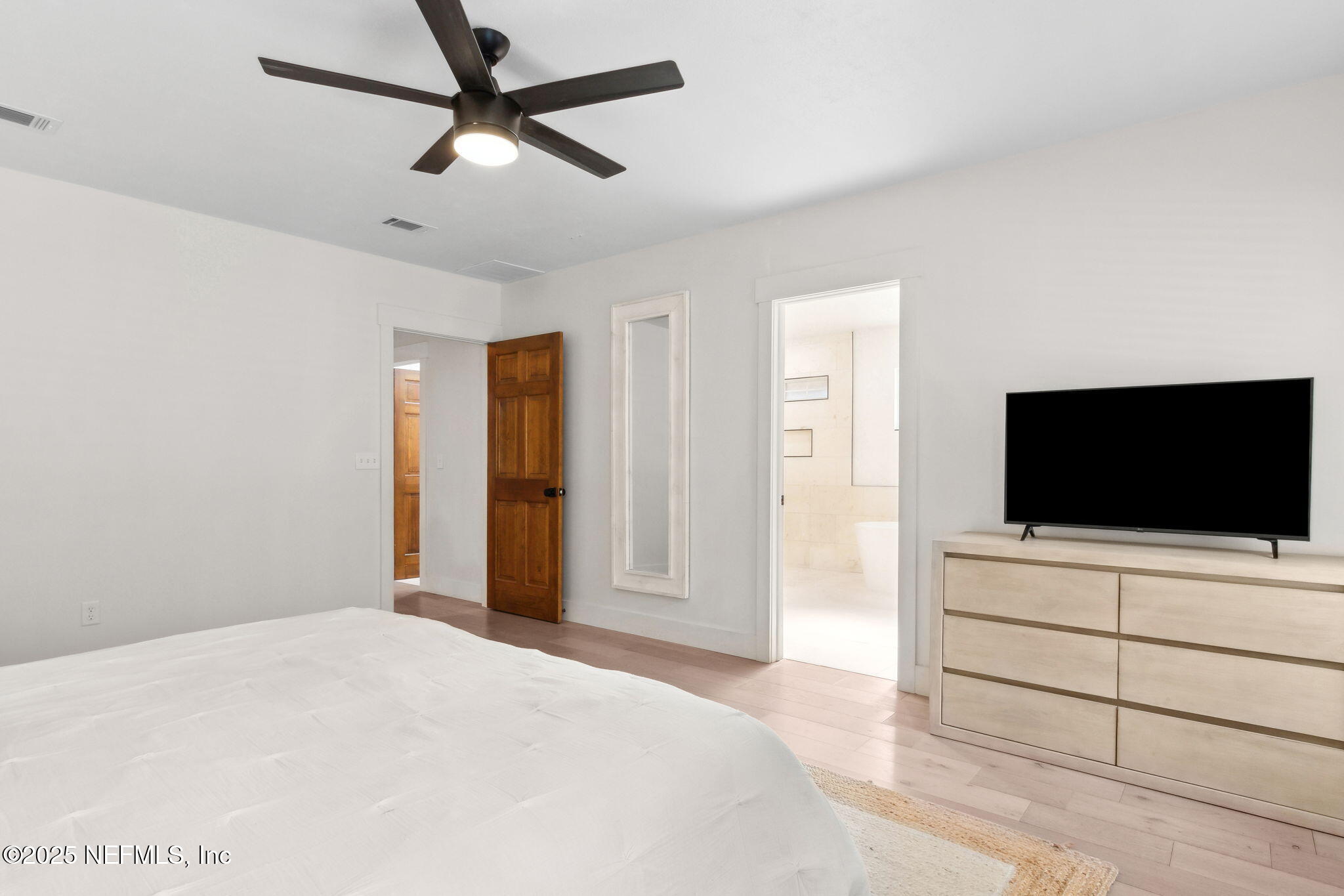 1908 Springbrook Road Fernandina Beach, FL 32034 - Photo 25 of 48 a bedroom with a bed and a flat screen tv