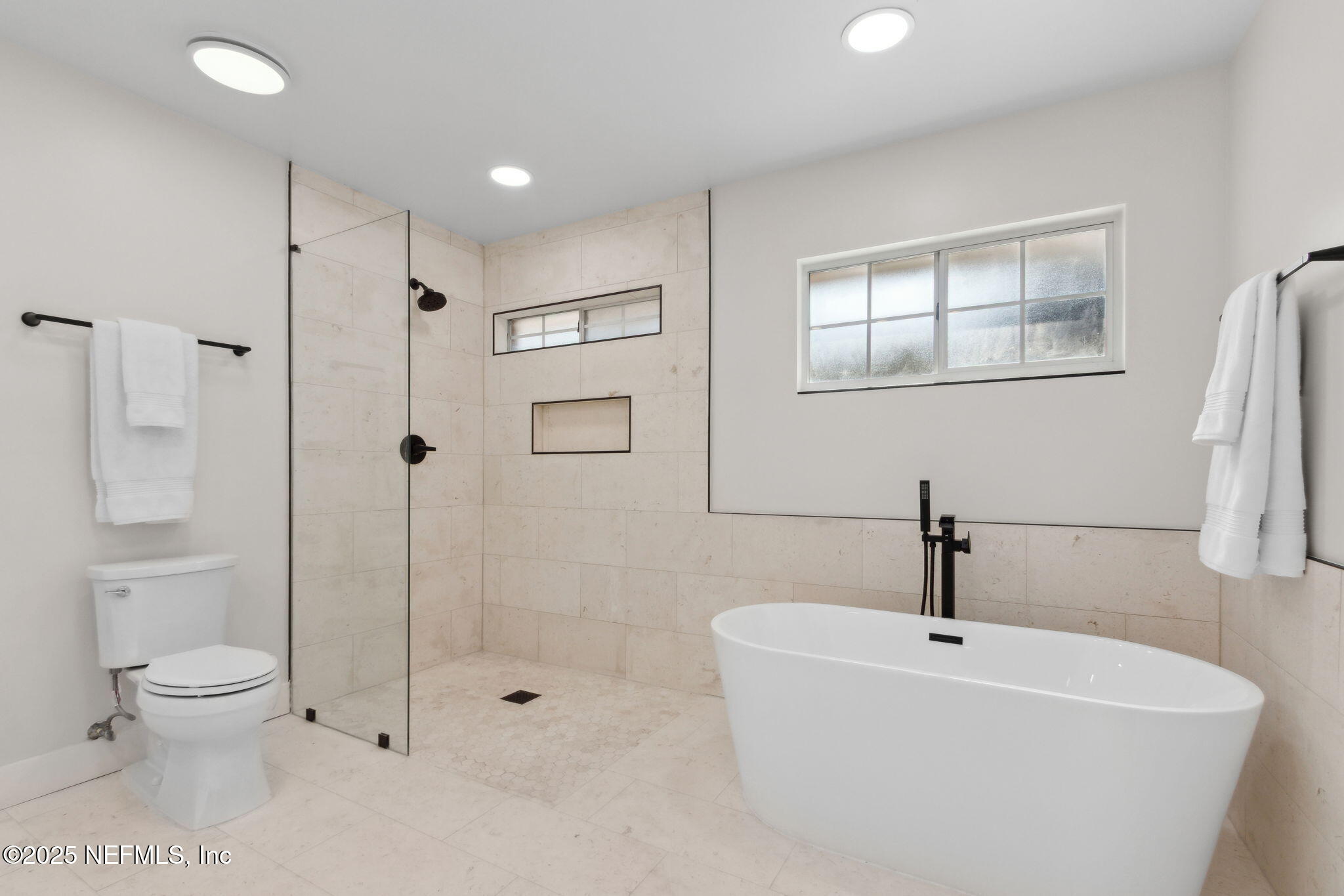 1908 Springbrook Road Fernandina Beach, FL 32034 - Photo 27 of 48 a bathroom with a bathtub shower sink mirror and toilet