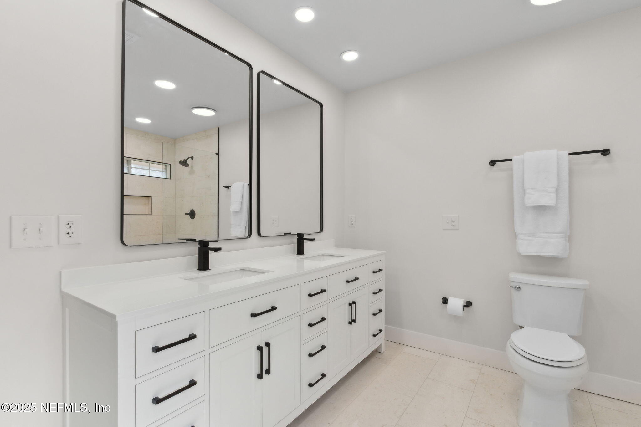 1908 Springbrook Road Fernandina Beach, FL 32034 - Photo 28 of 48 a bathroom with a sink and a mirror
