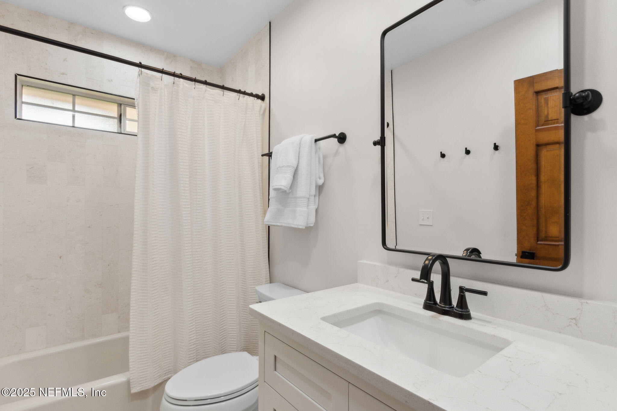 1908 Springbrook Road Fernandina Beach, FL 32034 - Photo 32 of 48 a bathroom with a sink toilet and shower