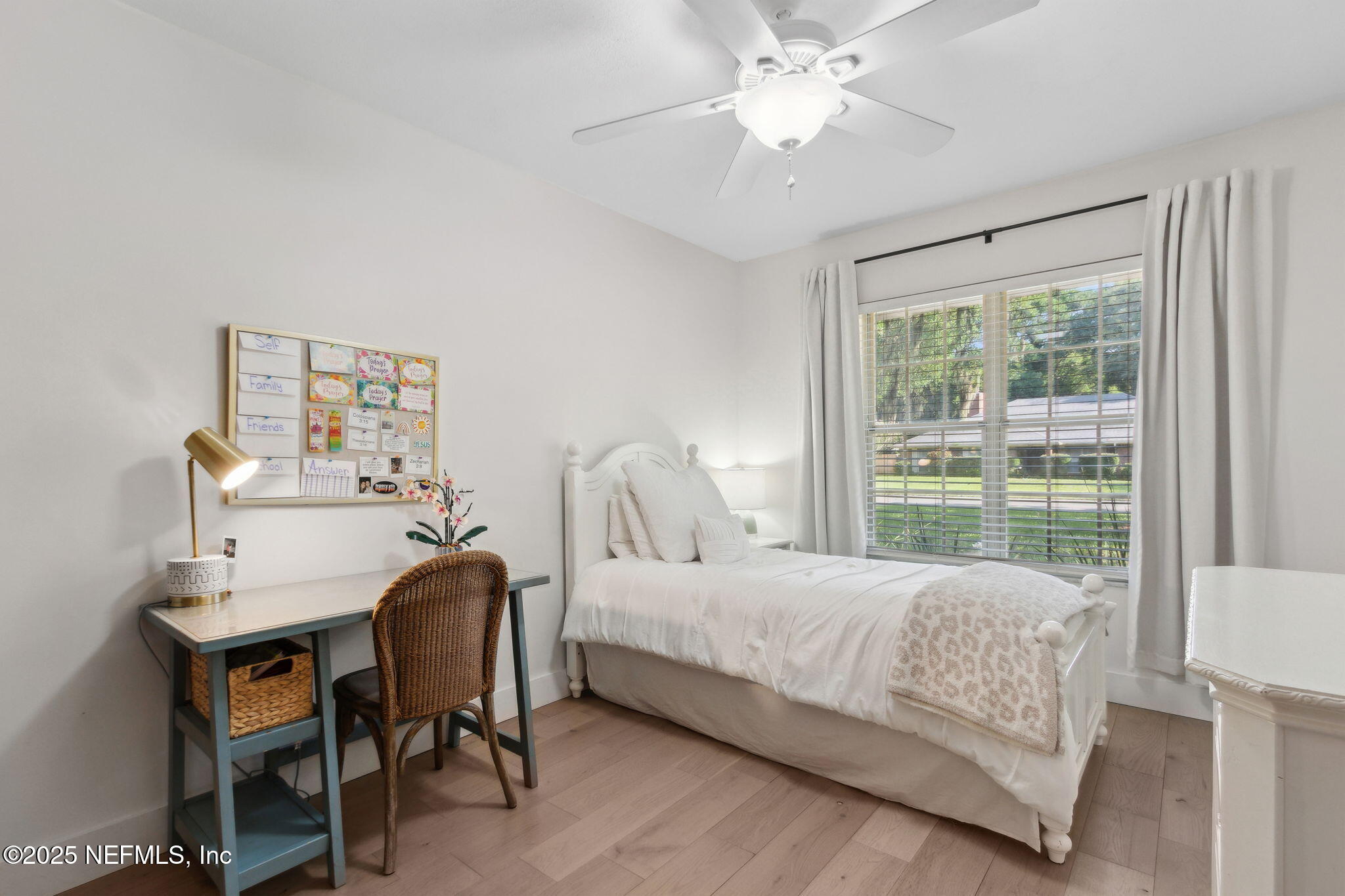 1908 Springbrook Road Fernandina Beach, FL 32034 - Photo 33 of 48 a bedroom with a bed and a table