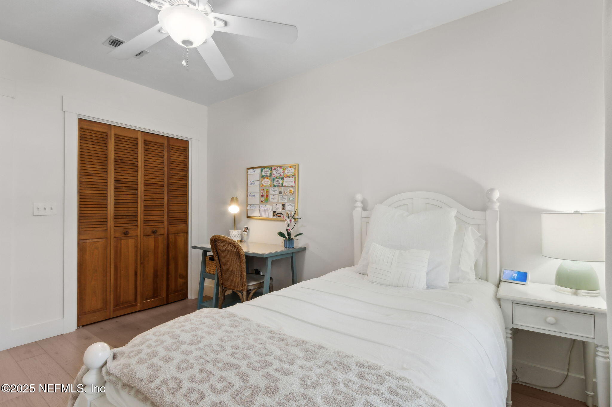 1908 Springbrook Road Fernandina Beach, FL 32034 - Photo 34 of 48 a bedroom with a bed and a chandelier