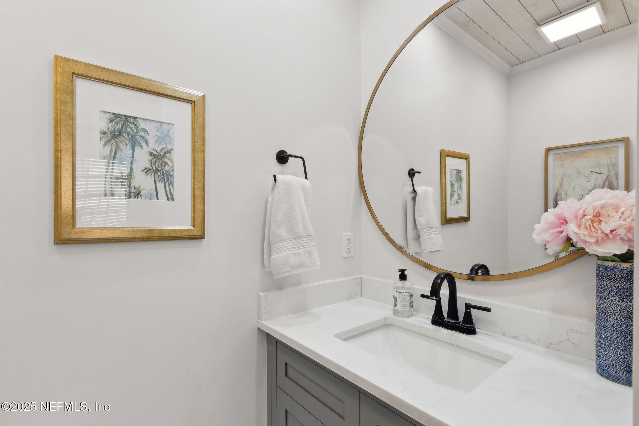 1908 Springbrook Road Fernandina Beach, FL 32034 - Photo 35 of 48 a bathroom with a sink and a mirror