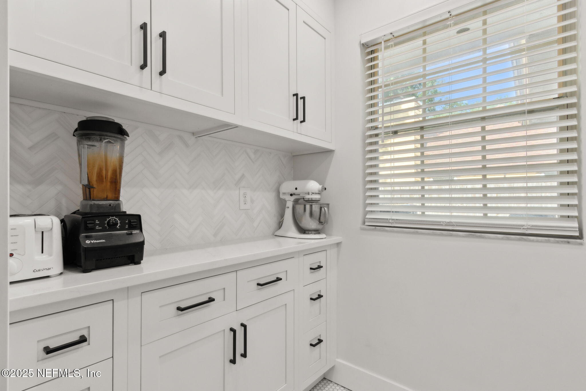 1908 Springbrook Road Fernandina Beach, FL 32034 - Photo 37 of 48 a kitchen with appliances cabinets and a window