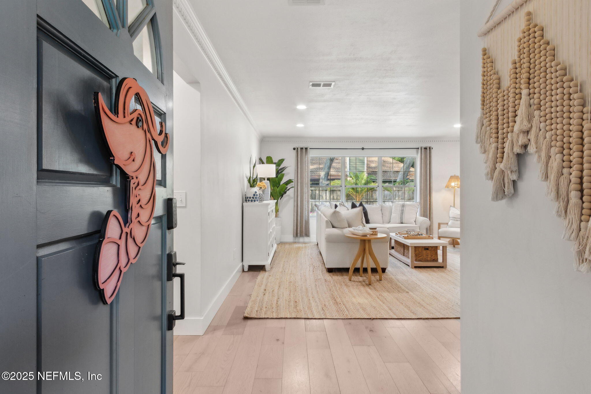 1908 Springbrook Road Fernandina Beach, FL 32034 - Photo 4 of 48 a living room with furniture and a floor to ceiling window